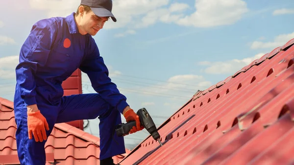 Close Young Happy Man Contractor Worker Blue Overalls Repairing Red — Stock Fotó
