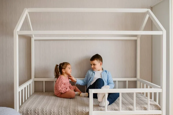 Two Children Brother Sister Sitting Montessori Bed Looking Each Other — Stock Photo, Image
