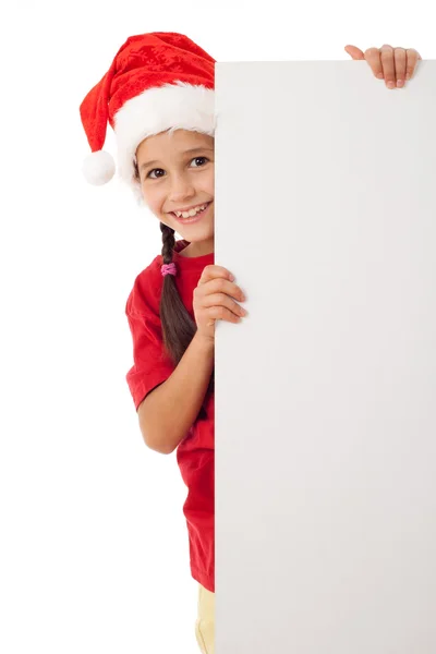 Menina de Natal de pé com vazio em branco — Fotografia de Stock