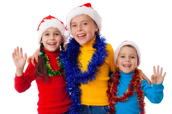 Noel Baba şapkaları üç mutlu çocuk — Stok fotoğraf