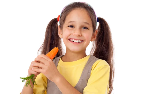 Menina comendo a cenoura Fotos De Bancos De Imagens Sem Royalties