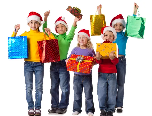 Gruppo di bambini felici con regali di Natale Immagini Stock Royalty Free