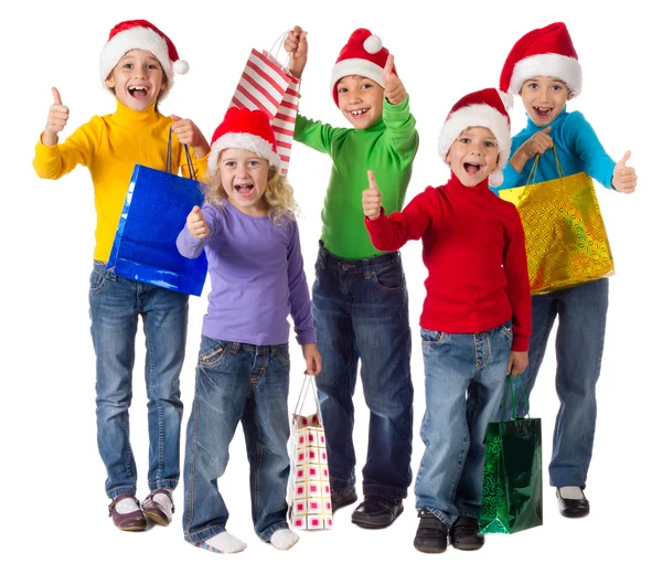 Gruppo di bambini felici con regali di Natale — Foto Stock