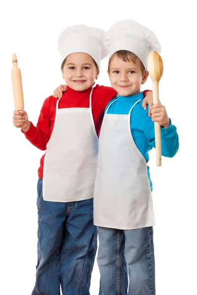 Pequenos cozinheiros com concha e rolo de pino — Fotografia de Stock