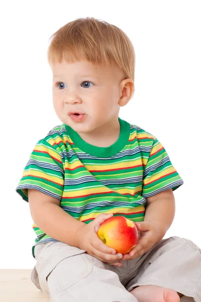 Baby with apple — Stockfoto