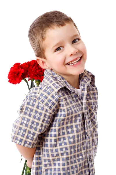 Usměvavý chlapec skrývá kytice Royalty Free Stock Obrázky