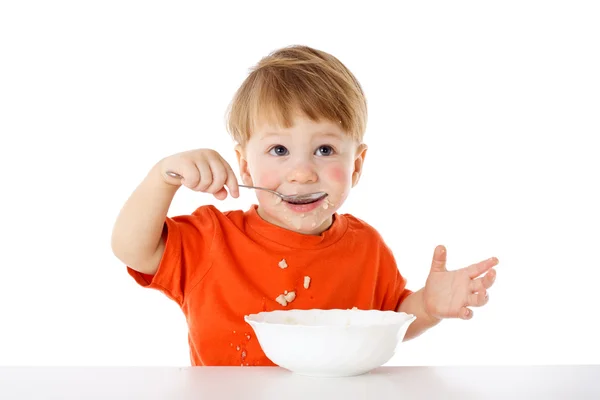 Baby eating the oatmeal — Stock Photo, Image