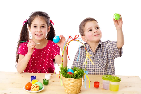 Two kids paint easter eggs — Stock Photo, Image