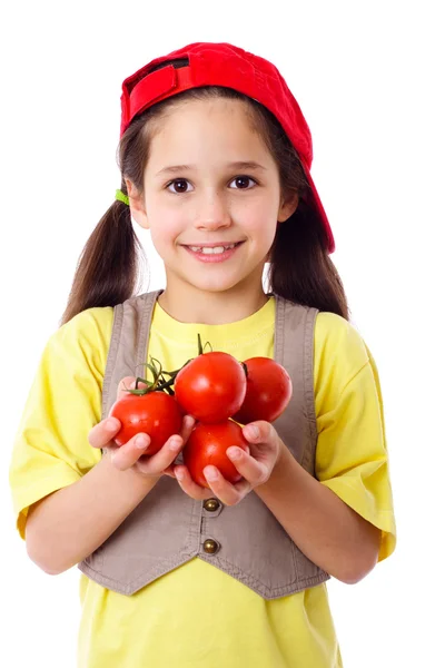 Ragazza sorridente con pomodori — Foto Stock