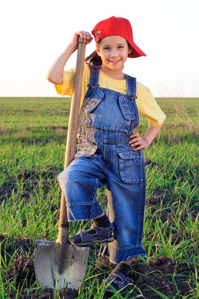 Smiling girl with shovel — Stock Photo, Image