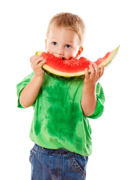 Drobná chlapec jíst meloun — Stock fotografie
