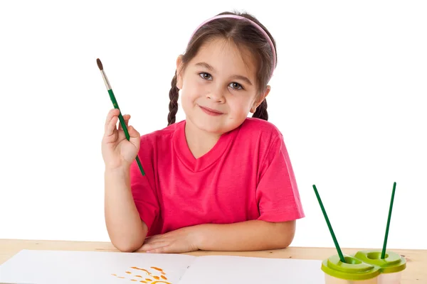 Inspired little girl with paintbrush — Stock Photo, Image