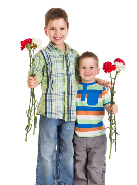 Two kids with carnations — Stock Photo, Image