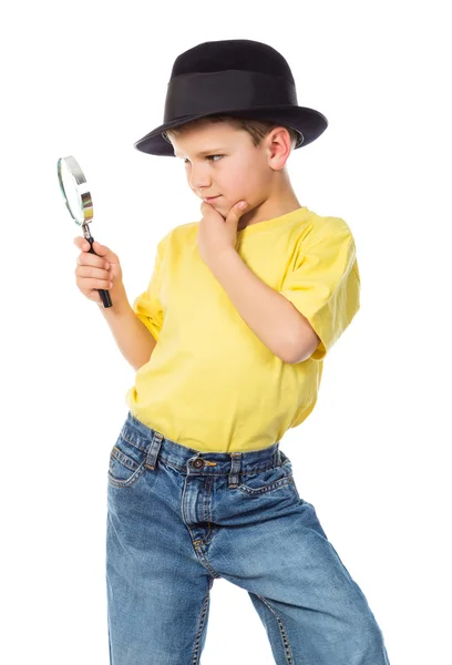 Boy in hat with magnifying glass — Stock Photo, Image