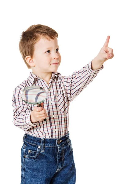 Kleine jongen met Vergrootglas glas en wijzen van teken — Stockfoto