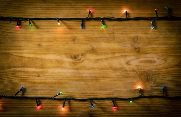 어두운 노란색의 축제용 배경에 램프의 프레임 크리스마스 — 스톡 사진