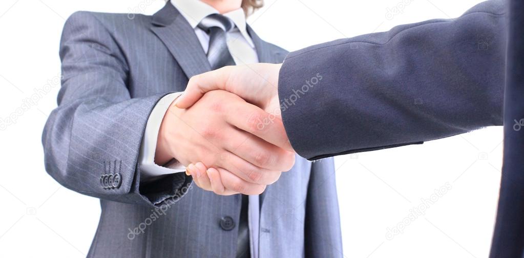 Handshake of the two businessmen, agreed in the contract. Isolated on a white background.