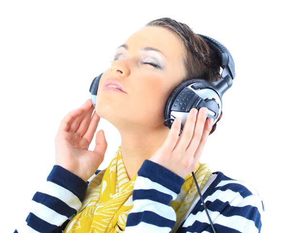 Hermosa chica con auriculares. Aislado sobre un fondo blanco —  Fotos de Stock