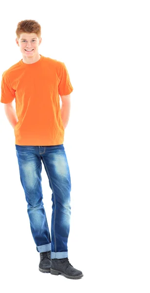 Portrait of handsome young man in casual clothes standing over w — Stock Photo, Image