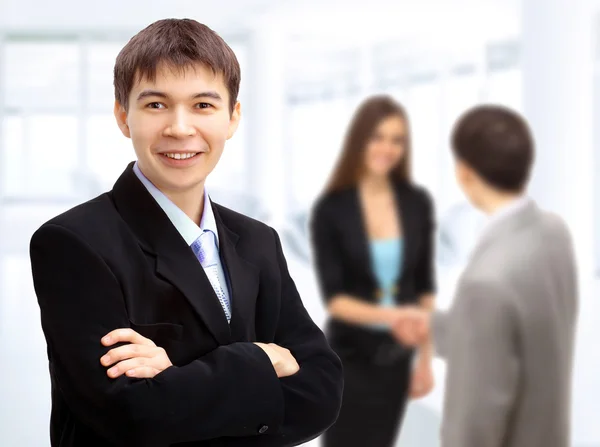 Beautiful business man. Negotiations in the office — Stock Photo, Image