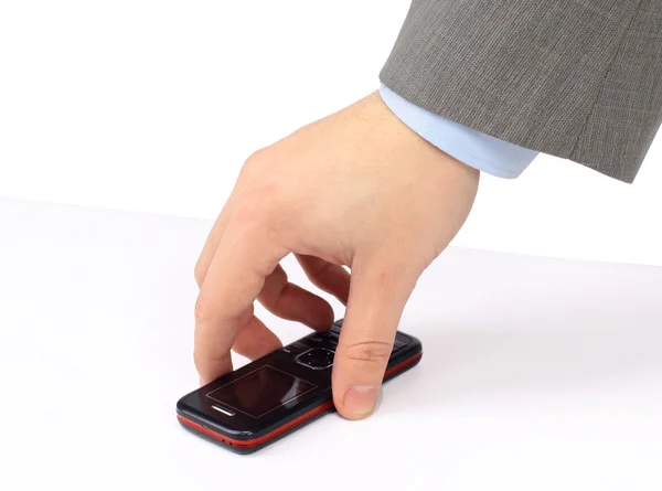 Geschäftsmann zückt seine Hand zu einem Handy. isoliert auf weißem Hintergrund. — Stockfoto