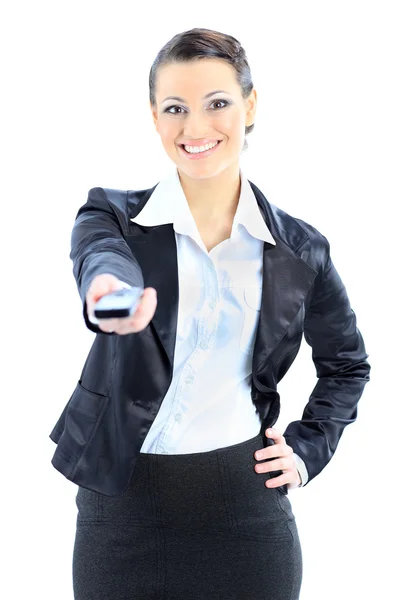Beautiful business woman points to the phone. Isolated on a white background. — Stock Photo, Image
