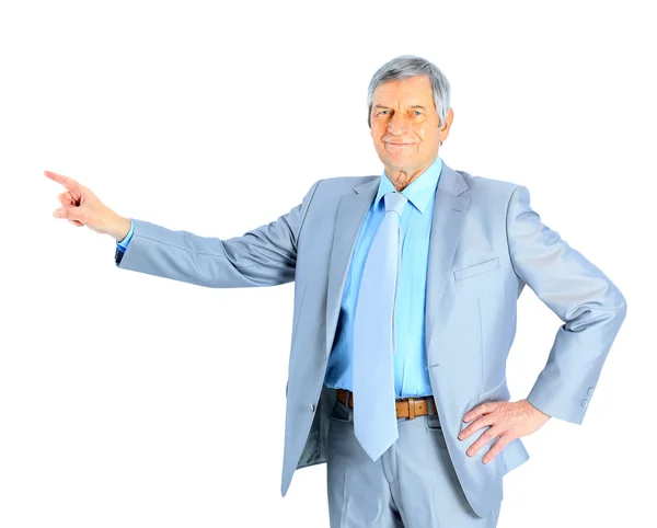 Nice businessman at the age, point the finger. Isolated on a white background. — Stock Photo, Image