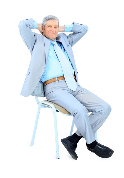 Homem de negócios em idade, descansando para uma pausa. Isolado sobre um fundo branco . — Fotografia de Stock