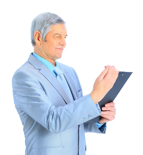 Belo homem de negócios na idade, a estudar o plano de trabalho. Isolado sobre um fundo branco . — Fotografia de Stock