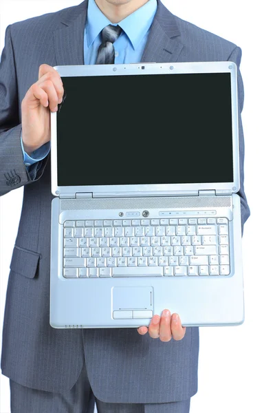 O jovem homem de negócios guarda o computador portátil. Isolado sobre um fundo branco . — Fotografia de Stock