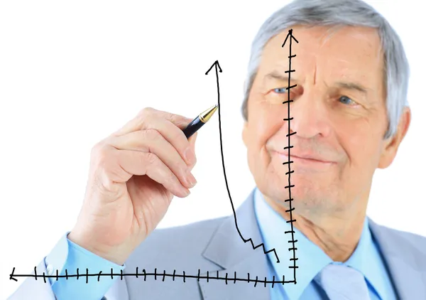 Empresario en edad, dibuja un gráfico. Aislado sobre un fondo blanco . —  Fotos de Stock