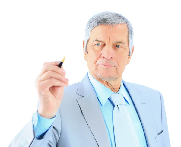 Businessman in age, writes in the air. Isolated on a white background. Stock Photo