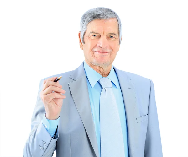 Businessman in age, writes in the air. Isolated on a white background. Royalty Free Stock Photos