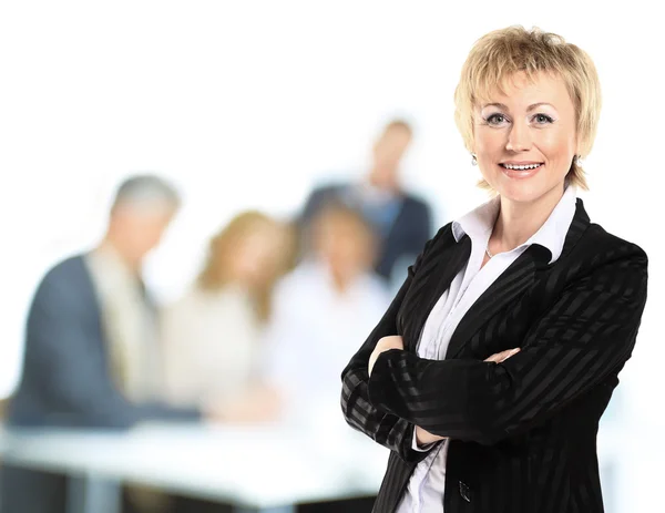 Confident business woman with team behind her — Stock Photo, Image