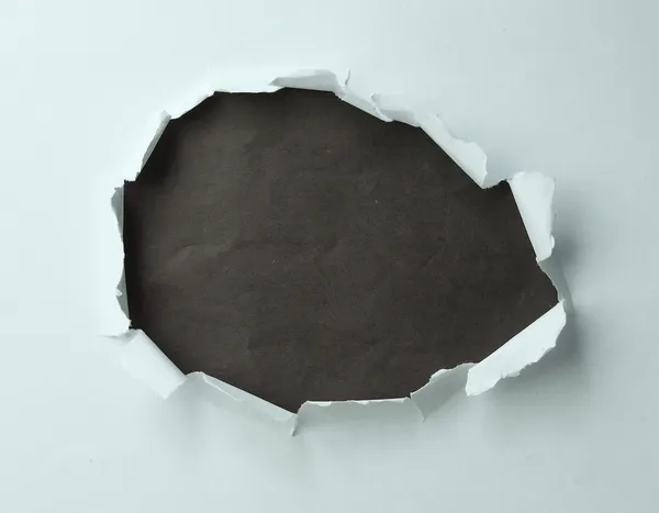 Dziura w papierze — Zdjęcie stockowe