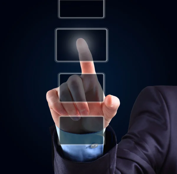 Business man pressing a touchscreen button Stock Picture