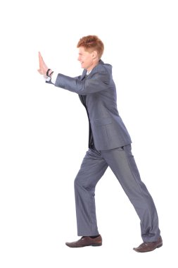 Beyaz bir arka plan üzerinde izole genç yakışıklı işadamı.