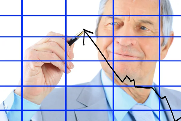 Businessman in age, draws a graph. Isolated on a white background. — Stock Photo, Image