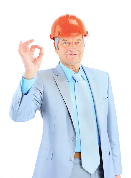 Engineer of age, shows that everything is OK. Isolated on a white background. — Stock Photo, Image