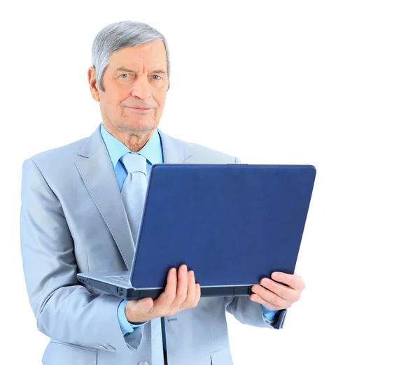 The businessman at the age of works for the laptop. Isolated on a white background. Royalty Free Stock Photos