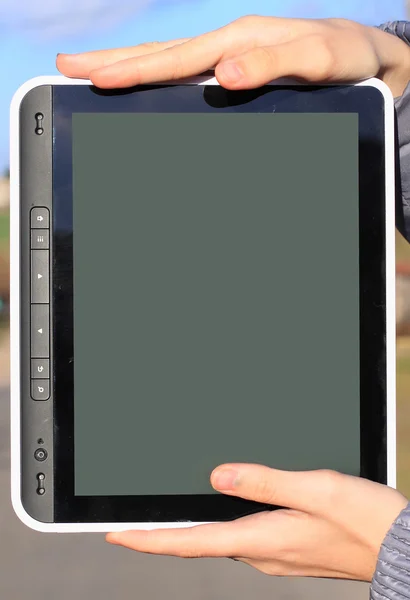 Female hands holding a tablet touch computer gadget with isolated screen — Stock Photo, Image