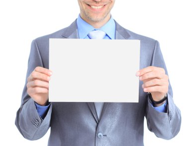 güzel iş adamı, beyaz poster tutar. Beyaz bir arka plan üzerinde izole.