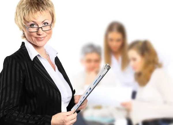 Confident business woman with team behind her — Stock Photo, Image