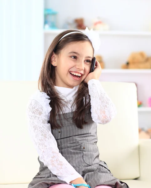Little girl talking on the phone. — Stock Photo, Image