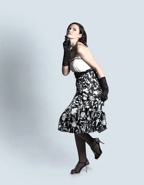 Fashion portrait of young beautiful woman in the black dress — Stock Photo, Image