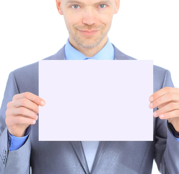 Nice businessman holds white poster. Isolated on a white background. — Stock Photo, Image