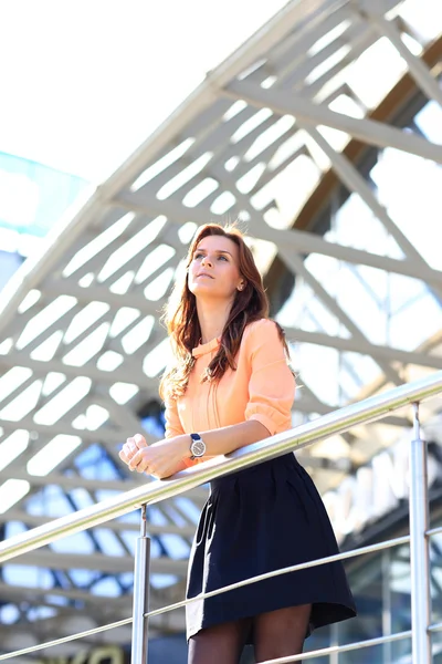 Portrait of young business woman on building background — Stock Photo, Image