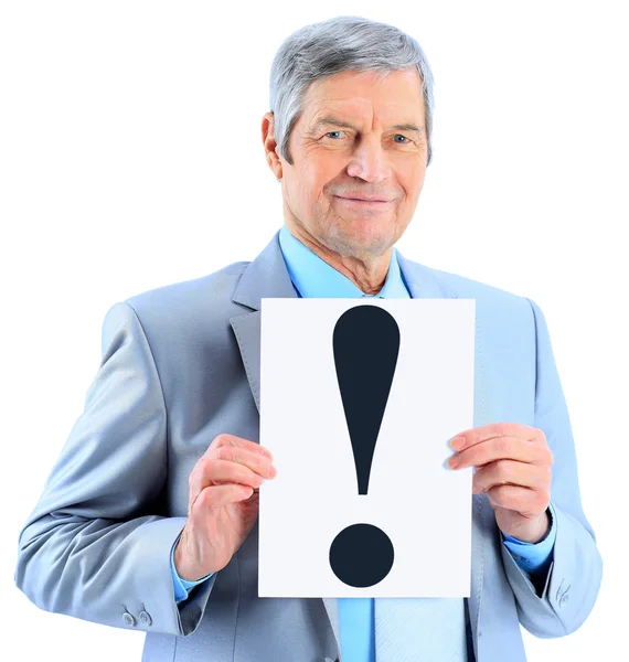 Nice businessman at the age, with an exclamation mark. Isolated on a white background. — Stock Photo, Image