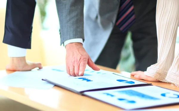 Close-up of female and male hands pointing at business document while discussing it — Stock Photo, Image