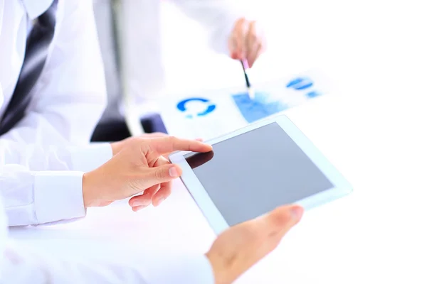 Image of human hand pointing at touchscreen with business document — Stock Photo, Image